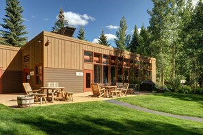 Enjoy expansive forest views from the large windows and relax on the patio with barbecue facilities.
