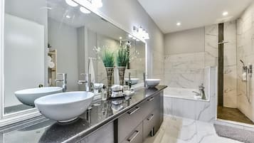 Separate tub and shower, free toiletries, hair dryer, bathrobes