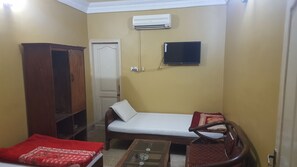 Basic Double or Twin Room, 1 Twin Bed, Non Smoking | Living area | Fireplace - Al mansoor hotel (Larkana)