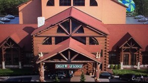 A large log cabin-style building with a prominent entrance labeled "Great Wolf Lodge."