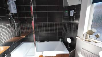 Combined shower/tub, hair dryer, towels, soap