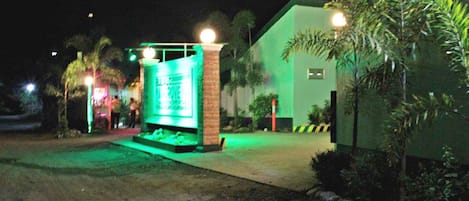 A building with a green exterior and a sign that reads "BULLDOGS."