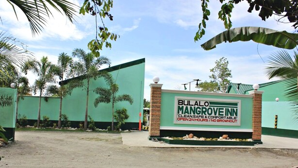 A sign for Bulalo Mangrove Inn, indicating it is open 24 hours with no brownout. - Bulalo Mangrove Inn (Calapan)