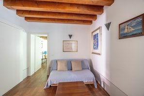 Comfort Apartment, 1 Bedroom | Living area | 12-inch flat-screen TV with cable channels, TV
