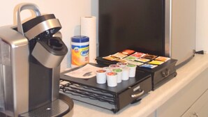 A kitchenette with a coffee machine, a kettle, a coffee pod dispenser, and a microwave. - West Racquet Club Art Hall (Palm Springs)