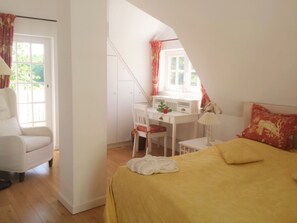 1 bedroom, desk, iron/ironing board, travel crib