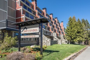 A multi-story residential building with a sign indicating '1849 Condos' and '826 Lakeview Blvd.'