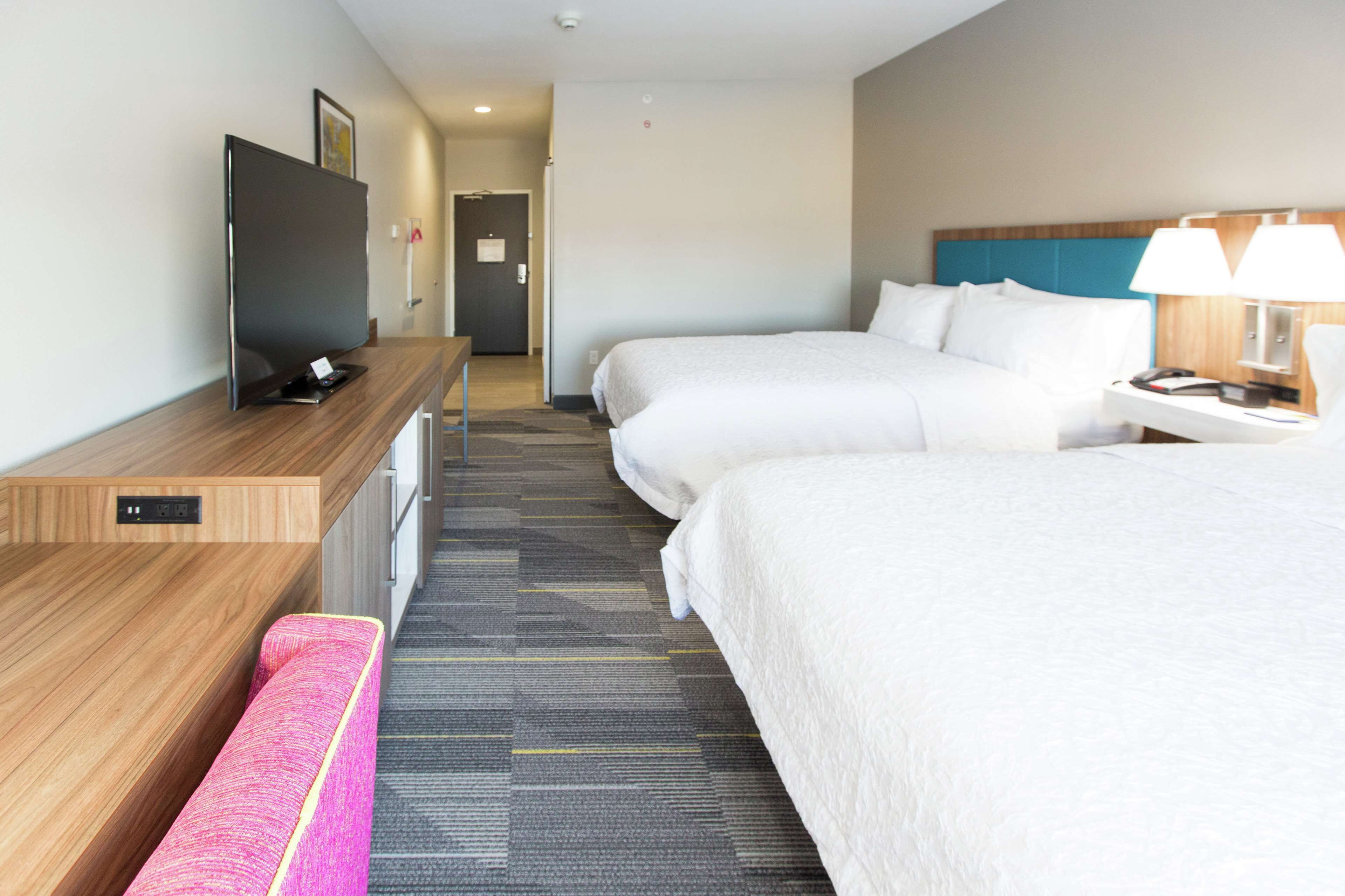 room, 2 queen beds, refrigerator & microwave | in-room safe, blackout curtains, cots/infant beds, free wifi