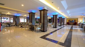 A spacious lobby with a central seating area, high ceilings, and modern lighting. - Bolu Termal Otel (Bolu)
