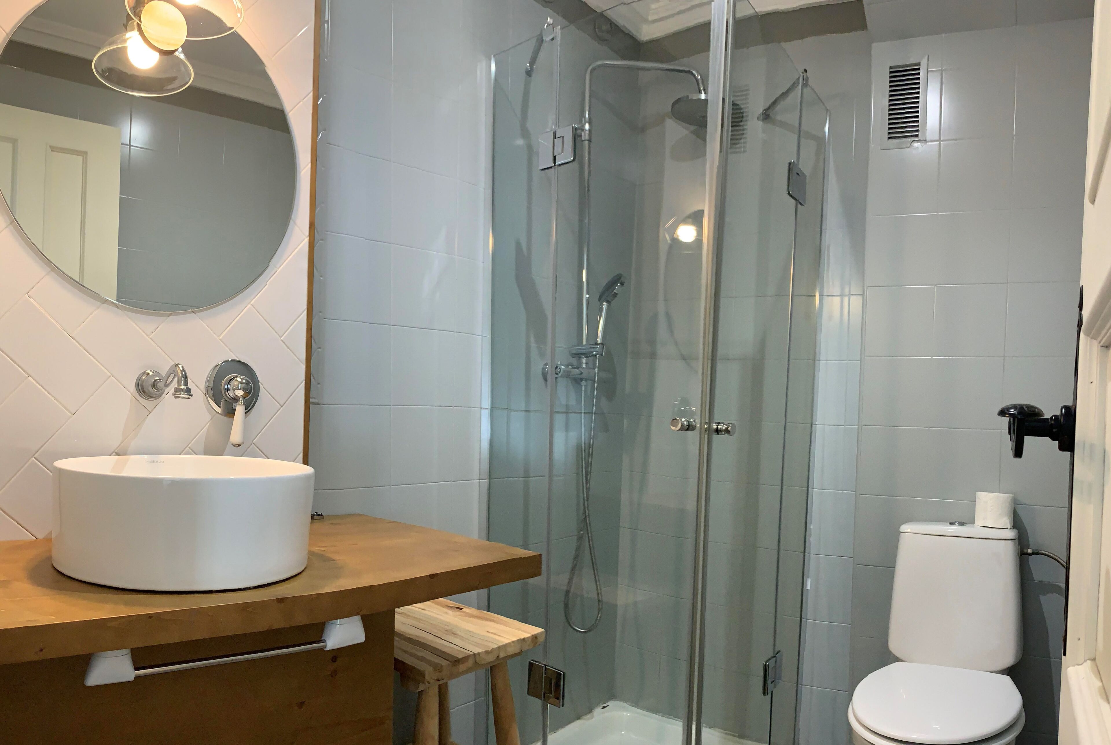 deluxe double room | bathroom | shower, rainfall showerhead, towels