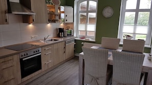 Classic Apartment (Langness) | Private kitchen | Fridge, stovetop, electric kettle, toaster