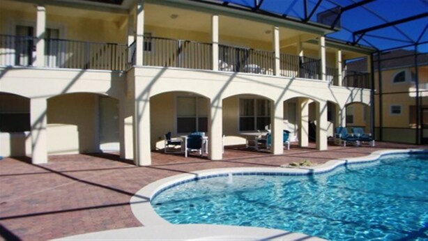 A pool area with a covered patio, outdoor seating, and a view of the pool. - Ov3125 - Highlands Reserve - 6 Bed 4 Baths Villa (Davenport)