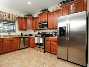 Family Villa, Balcony, Garden Area | Shared kitchen | Fridge, microwave, oven