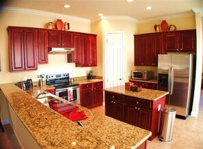 Family Villa, Balcony, Garden Area | Shared kitchen | Fridge, microwave, oven