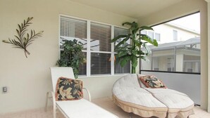 A room with a bed, a chair, and a large window. - Ov2929 - Windsor Hills Resort - 5 Bed 5 Baths Villa (Kissimmee)