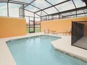 An indoor swimming pool with a glass ceiling, surrounded by beige walls and a white pool deck. - Ov2899 - Paradise Palms - 4 Bed 3 Baths Townhome (Kissimmee)