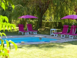 Seasonal outdoor pool, open 11 AM to 10 PM, pool loungers