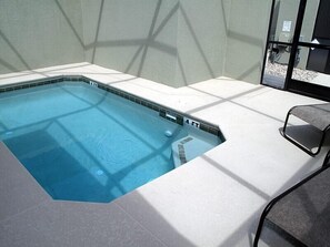 A rectangular hot tub with a tiled edge, a 4 FT depth marker, and a white tiled floor surrounding it.