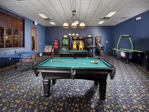 Enjoy games and fun in this lively room with a pool table, additional pool tables, and a ping pong table.