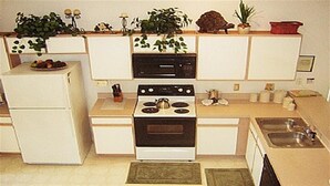 A compact kitchen with a refrigerator, stove, microwave, and sink. - Ov2487 - Hampton Lakes - 5 Bed 3 Baths Villa (Davenport)