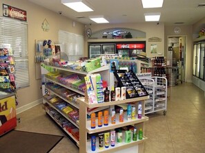 Convenience store with shelves stocked with a variety of products.