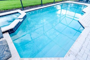 A swimming pool with a tiled deck and a small hot tub area. - Ov2427 - Windsor Hills Resort - 6 Bed 4 Baths Villa (Kissimmee)