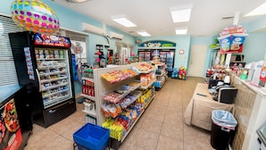A grocery store with refrigerated sections, snack aisles, and a checkout area. - Ov2484 - Windsor Hills Resort - 5 Bed 5 Baths Villa (Kissimmee)