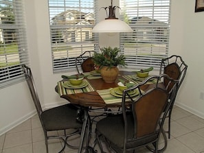 Enjoy meals in this dining area with a round table and four comfortable chairs.