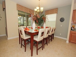 A dining room with a rectangular table, six chairs, and a chandelier. - Ov2884 - Paradise Palms - 6 Bed 5 Baths Villa (Kissimmee)