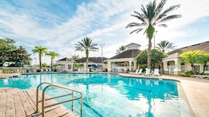 A swimming pool with clear blue water, surrounded by lounge chairs and palm trees. - Ov2311 - Windsor Palms Resort - 3 Bed 2.5 Baths Townhome (Kissimmee)