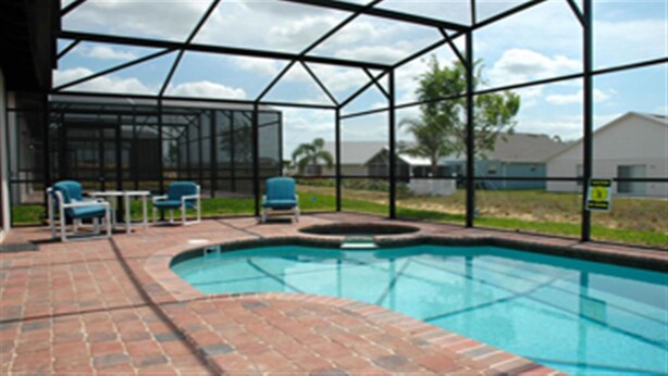 A swimming pool with a brick patio and blue chairs. - Ov2749 - High Grove - 4 Bed 3 Baths Villa (Clermont)