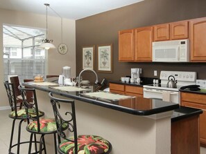 Family Villa, Balcony, Garden Area | Shared kitchen facilities