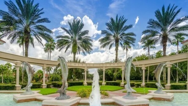 A water feature with multiple fountains, palm trees, and a pergola structure in a landscaped garden. - Ov535 - Emerald Island - 7 Bed 4 Baths Villa (Kissimmee)