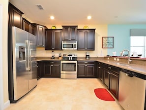 Family Villa, Balcony, Garden Area | Shared kitchen | Fridge, microwave, oven