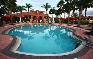 A circular pool with a red-tiled deck, surrounded by palm trees and lounge chairs. - Ovm3959 - Solana - 7 Bed 5.5 Baths Villa (Davenport)