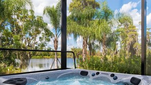 A hot tub with a view of a lake and trees. - Ov3978 - Formosa Gardens - 7 Bed 7.5 Baths Villa (Kissimmee)