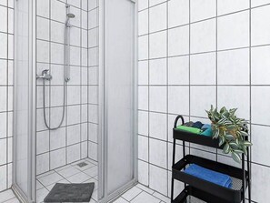 Regadera y papel de baño 