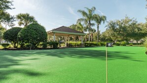 A golf course with a pavilion, a putting green, and a flagstick. - Ov4200 - Windsor Hills Resort - 3 Bed 3 Baths Villa (Kissimmee)