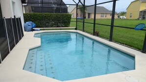 A swimming pool with a tiled deck and a view of a residential area. - Ov3786 - Cumbrian Lakes - 4 Bed 3.5 Baths Villa (Kissimmee)