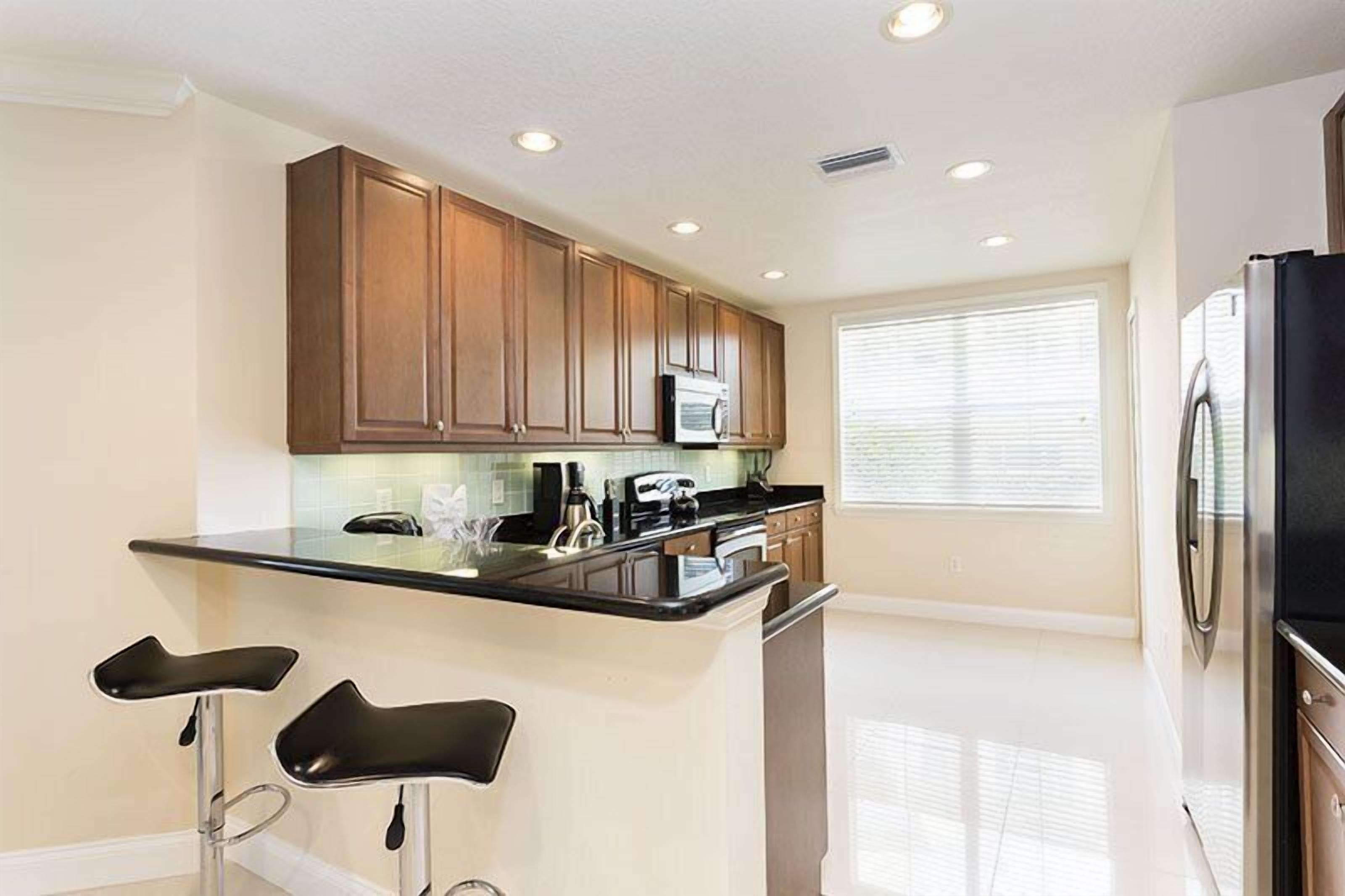 Family Condo, Balcony, Garden Area | Shared kitchen | Fridge, microwave, oven