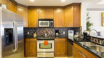 Family Condo, Kitchen, Garden Area | Shared kitchen | Fridge, microwave, oven