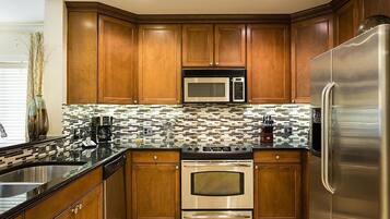 Family Condo, Balcony, Garden Area | Shared kitchen | Fridge, microwave, oven