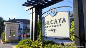 A sign for Lucaya Village Resort in Kissimmee, FL.
