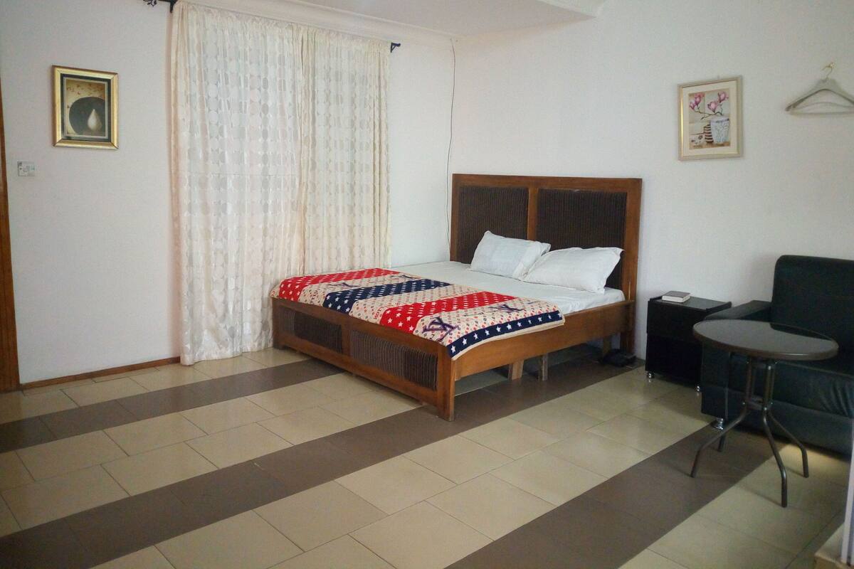 Desk, laptop workspace, bed sheets