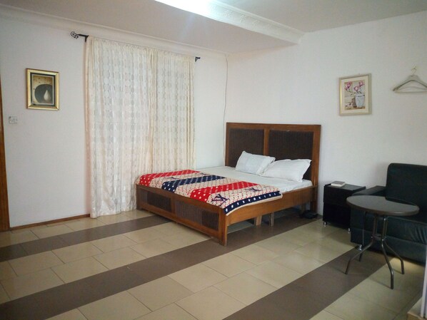 Desk, laptop workspace, bed sheets