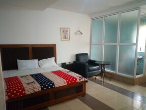 Desk, laptop workspace, bed sheets