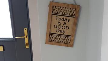 A door with a brass handle and a small window.