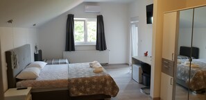 Family Room, Balcony | Minibar, in-room safe, soundproofing, iron/ironing board
