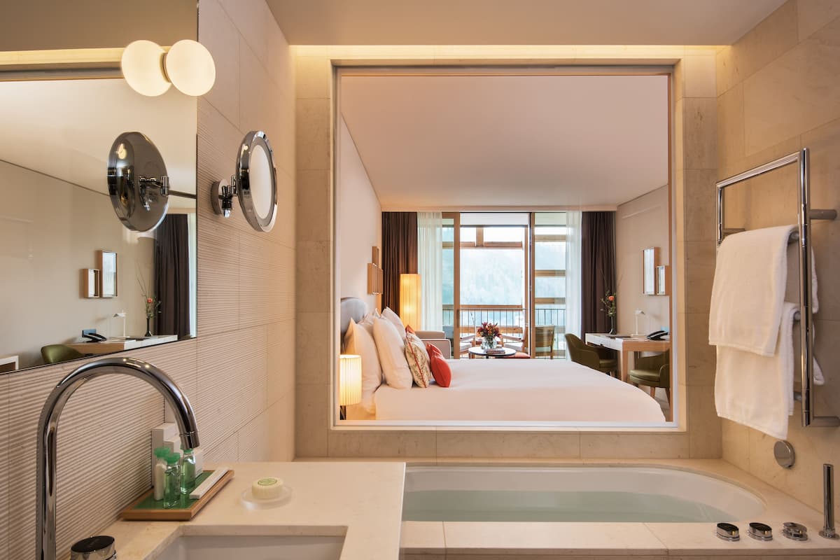 alpine deluxe room with terrace | bathroom | separate bathtub and shower, deep-soaking bathtub, rainfall showerhead