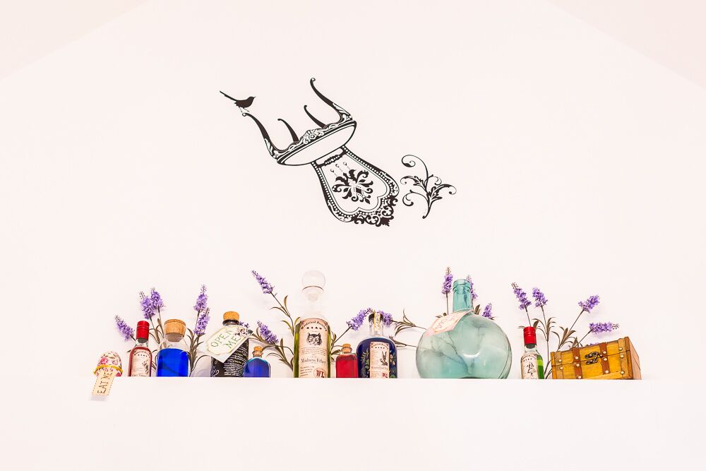 A collection of bottles and a decorative item on a white background.